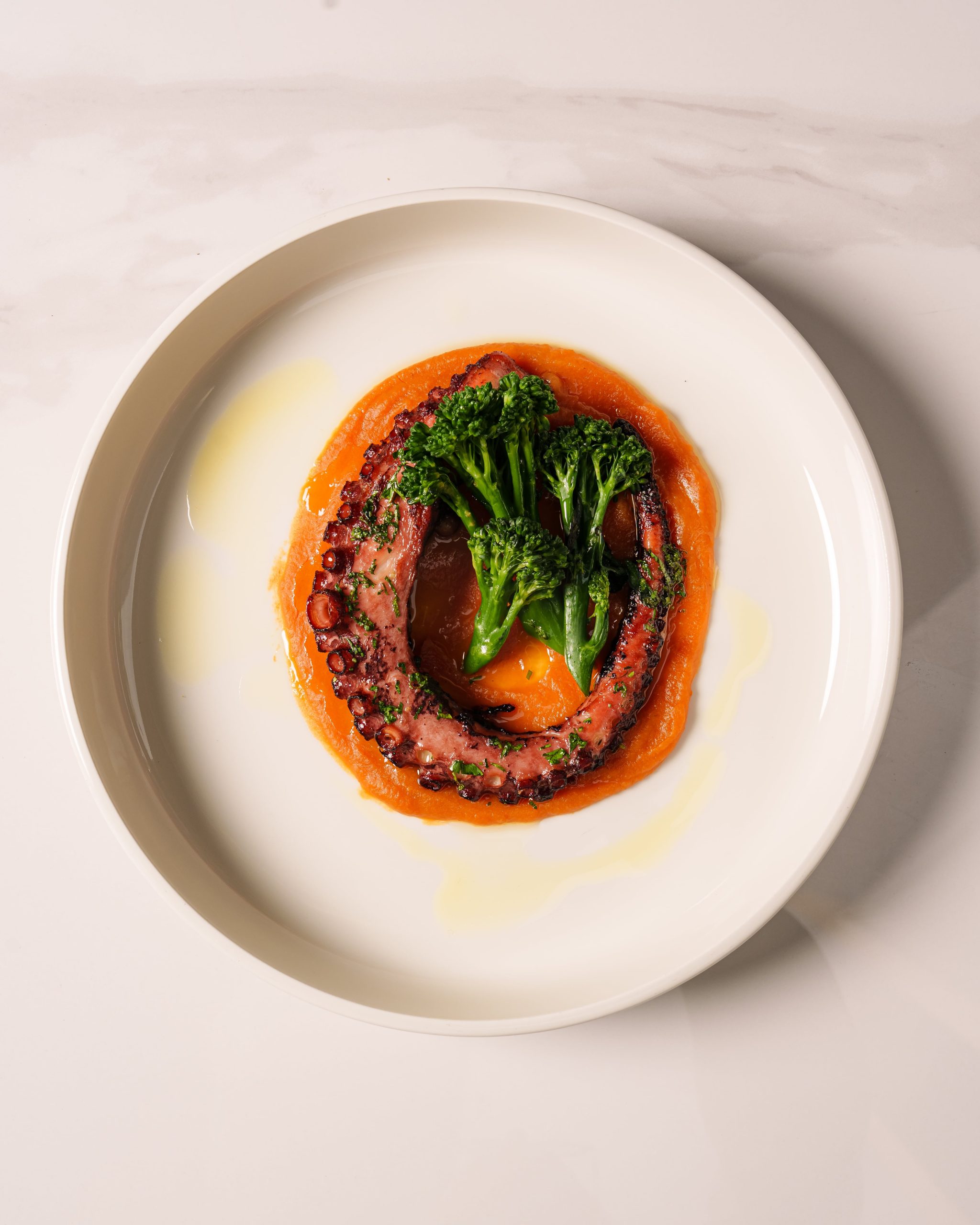 Grilled octopus, sweet potato purée, broccolini